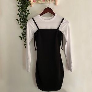 Black bodycon dress with removable white long sleeve shirt underneath. Brand new